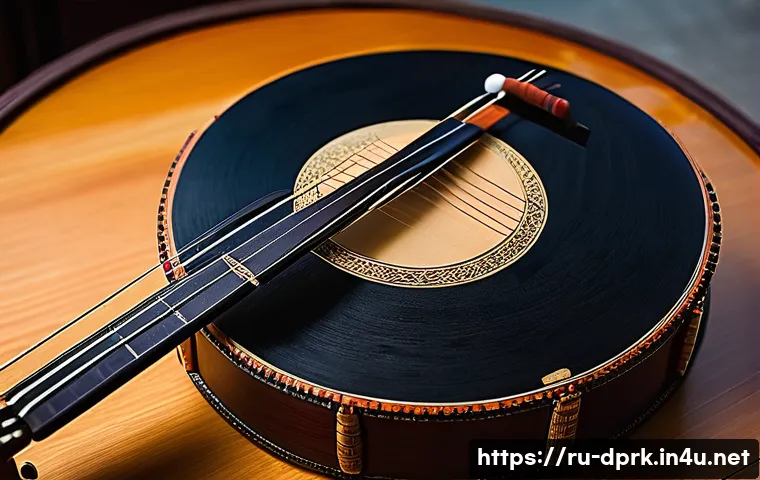 북한의 전통 악기 아쟁과 장고 - A traditional Korean ayan string instrument crafted from polished special wood with a long, hollowed...