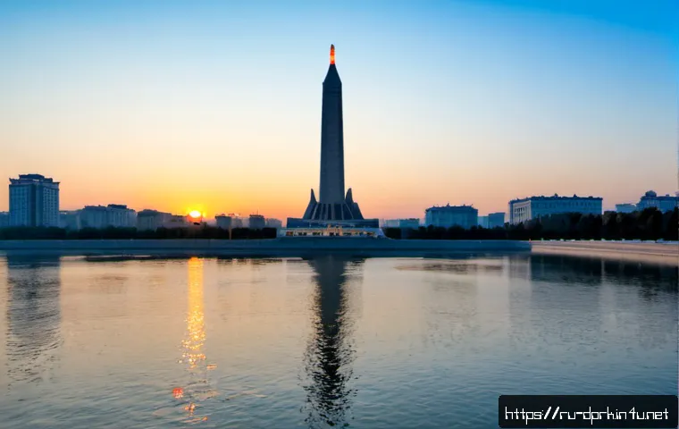 북한의 건축물   주체사상탑의 의미 - Photorealistic wide-angle view of the Juche Tower rising beside the Taedong River in Pyongyang at su...